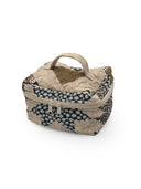 Patterned fabric storage bag with a handle on a white background