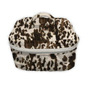 cow print makeup bag with a white zipper on a white background