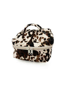 cowhide print makeup bag on a white background