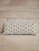 Floral-patterned pillow on a wooden surface