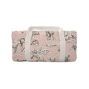 Soft pink wallet with floral design and a light-colored strap, elegantly styled and compact.