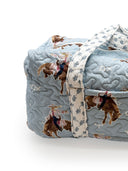 Quilt with cowboy pattern on a white background