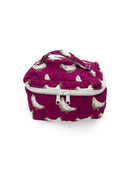 berry colored quilted travel bag with white chicen pattern
