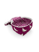 berry colored quilted travel bag with white chicen pattern