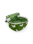 sage green quilted travel bag with white chicken pattern