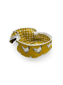 mustard yellow quilted travel bag with white chicken pattern