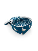 blue quilted travel bag with white chicken pattern 