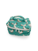 turquoise qulited travel bag with white chicken pattern