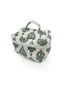 Floral-patterned makeup bag on a white background