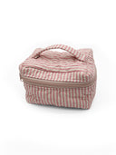 Pink and white striped bag on a white background