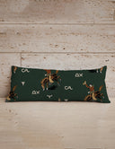 Long rectangular pillow with cowboy and horse pattern on a wooden surface