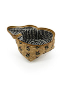 brown quilted travel case with a bucking horse on it. The top of the bag is open and showing a brown and cream striped pattern inside. 