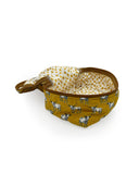 mustard yellow quilted travel bag with white longhorn pattern