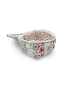 Floral-patterned cosmetic bag on a white background