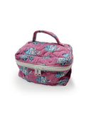 Pink quilted makeup bag with blue floral pattern on a white background