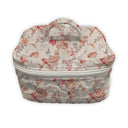 Floral-patterned fabric make up bag on a white background