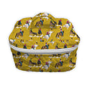 mustard colored quilted make up bag with rodeo event pattern