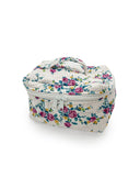 white quilted travel case with blue, pink, greenm and yellow floral pattern
