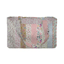 Colorful and patterned wallet with floral and abstract designs on a textured background.