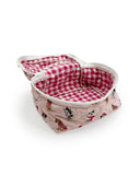 opened light pink quilted travel bag with dogs wearing pink sweaters as the pattern 