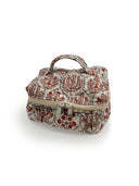 cream quilted travel bag with pink tone floral pattern