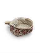 cream quilted travel bag with pink tone floral pattern