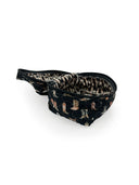 Black cosmetic bag with boot pattern on a white background