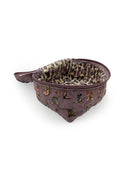 purple quilted travel case with thunderbird boot design 