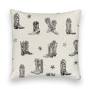 Decorative pillow with black cowboy boot and star pattern on a white background