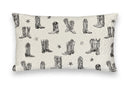 Pillow with black cowboy boot pattern on a white background