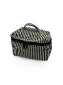 Striped fabric bag with a black zipper on a white background