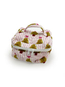 pink and white striped quilted travel case with green christmas tree, pink bow, and red pot
